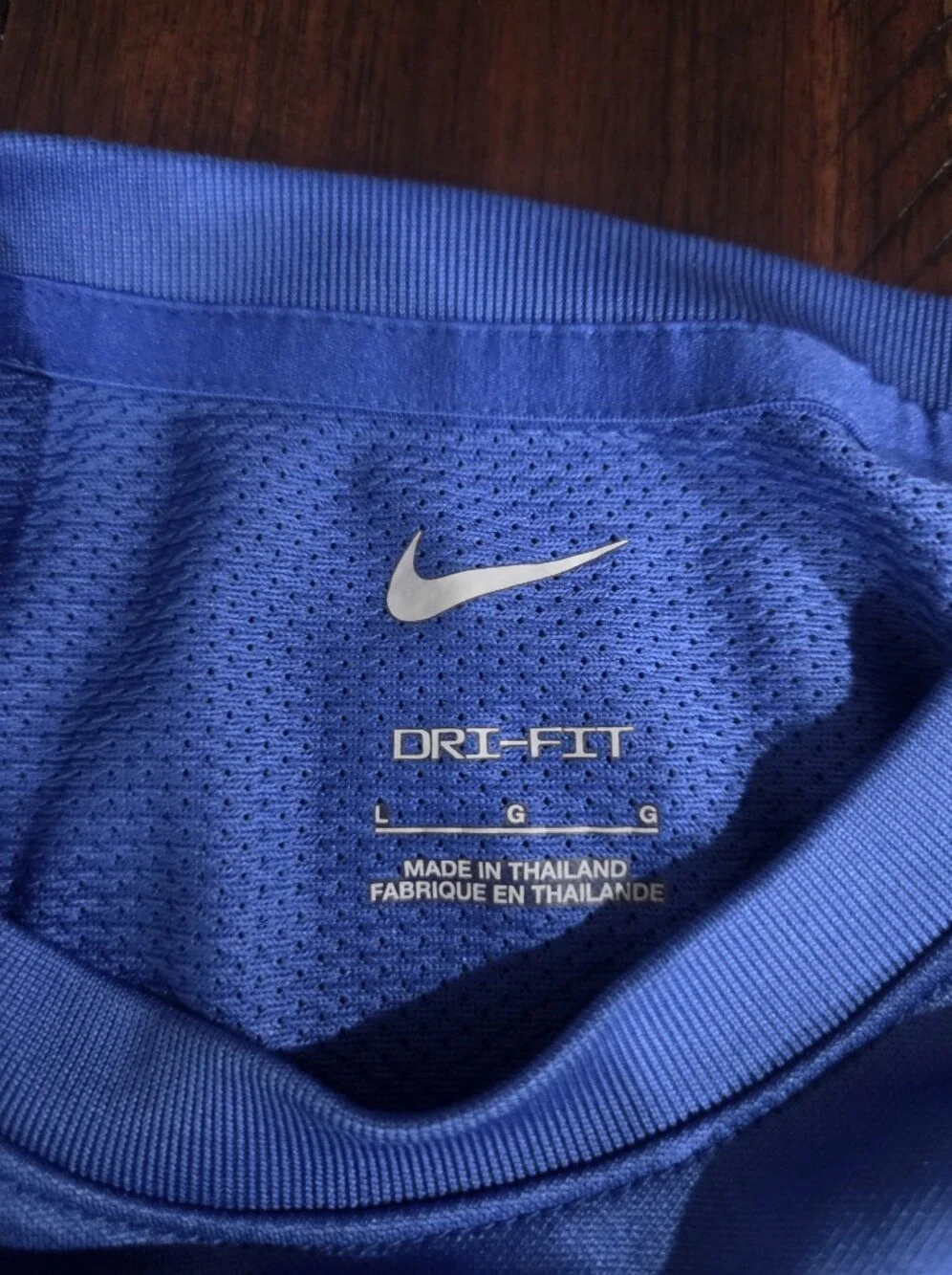 Nike youth large Blue Performance Tee with White nike swoosh Graphic